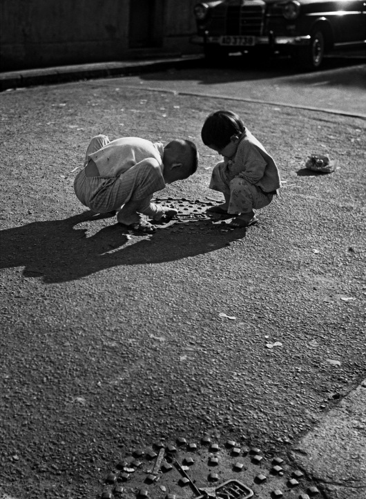 Playing Marbles in Causeway Bay