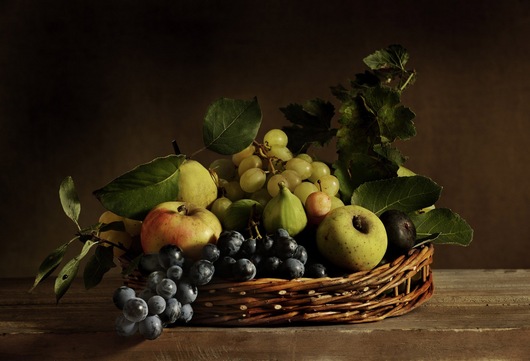 Still life with grapes, apples, figs and prunes
