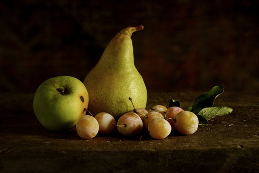 Still life with pear, apple and prunes