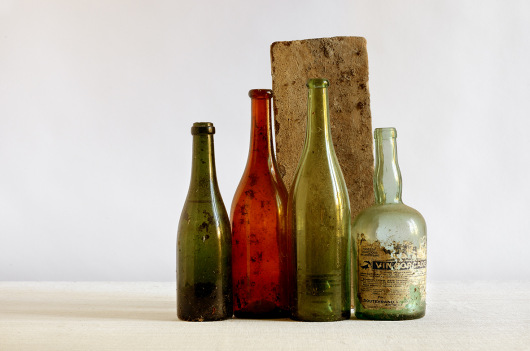 Four bottles and a brick