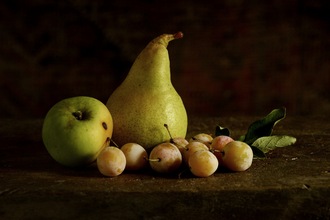 Still life with pear, apple and prunes