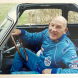 Lap of Honour: A Photographic Journey with Sir Stirling Moss with photograph SIGNED by both Moss and Hain